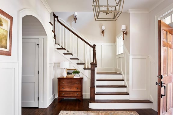 Gorgeous Entryway with Staircase and Modern Industrial Light Fixture by Copper Sky