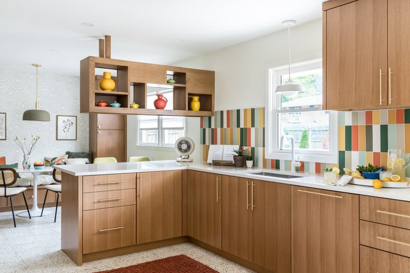 A stylish kitchen showcasing bright tiles and wooden cabinetry. | Copper Sky Design + Remodel