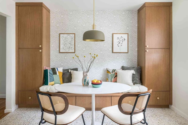 A charming dining area with a table and chairs, designed for comfort and style. | Copper Sky Design + Remodel